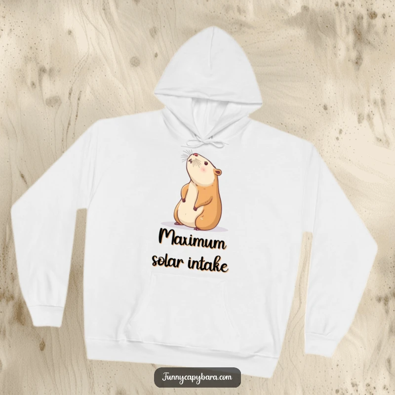 Funny Capybara Hoodie: A plush hoodie showing a capybara languidly stretching towards a gentle sunbeam, promoting relaxation.