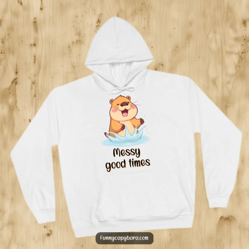Funny hoodie showcasing a capybara joyfully splashing water with its paws, looking absolutely delighted.